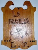 'La Familia L.F.' woodburning by Ed Rue, 1992, Monticello Middle School technology class.