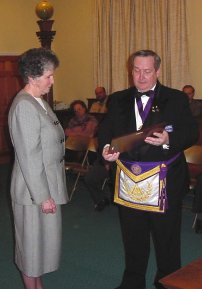 Sister Kevin John Shields, O.P., receives the DeWitt Clinton Award for community service from the hands of District Deputy Grand Master John Green. TRR photo by Tom Rue.