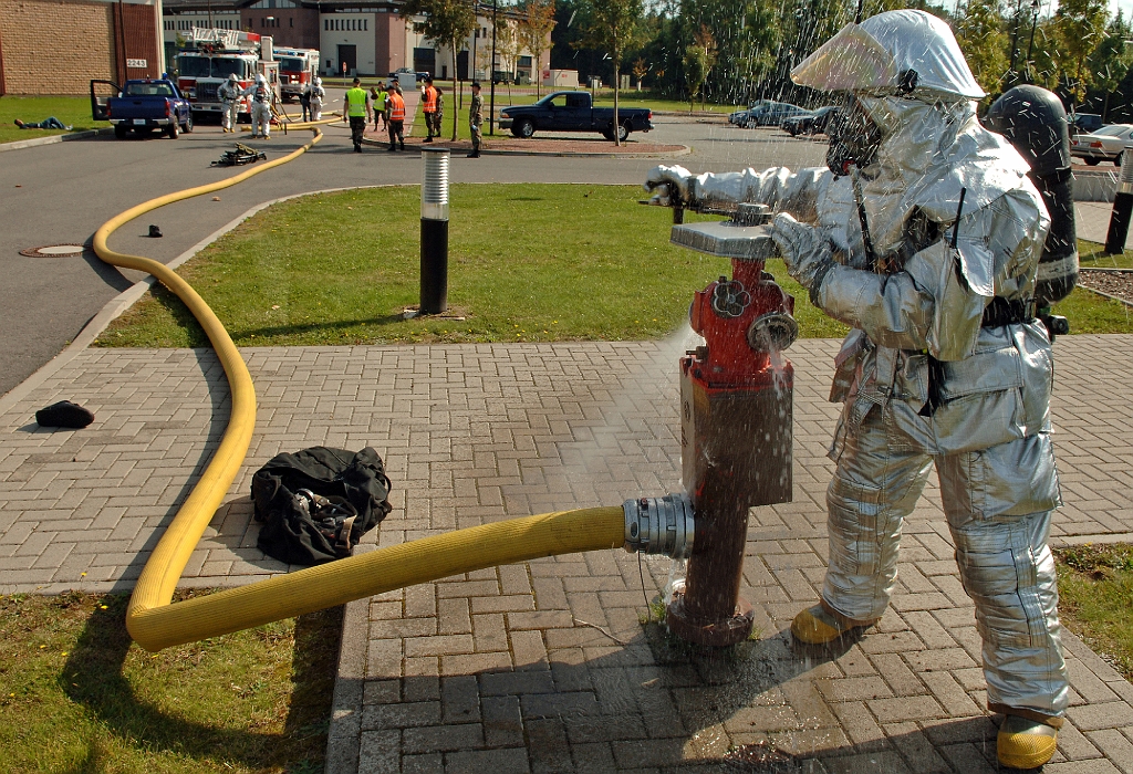 defenselink.mil-homepagephoto_2007-09_hires_070922-F-5858L-003a.jpg - U.S. Air Force Airman Clinton Tidd, a fire fighter with 435th Civil Engineer Squadron, opens a fire hydrant during a major accident response exercise on Ramstein Air Base, Germany, Sept. 22, 2007. (U.S. Air Force photo by Airman 1st Class Marc I. Lane) (Released)