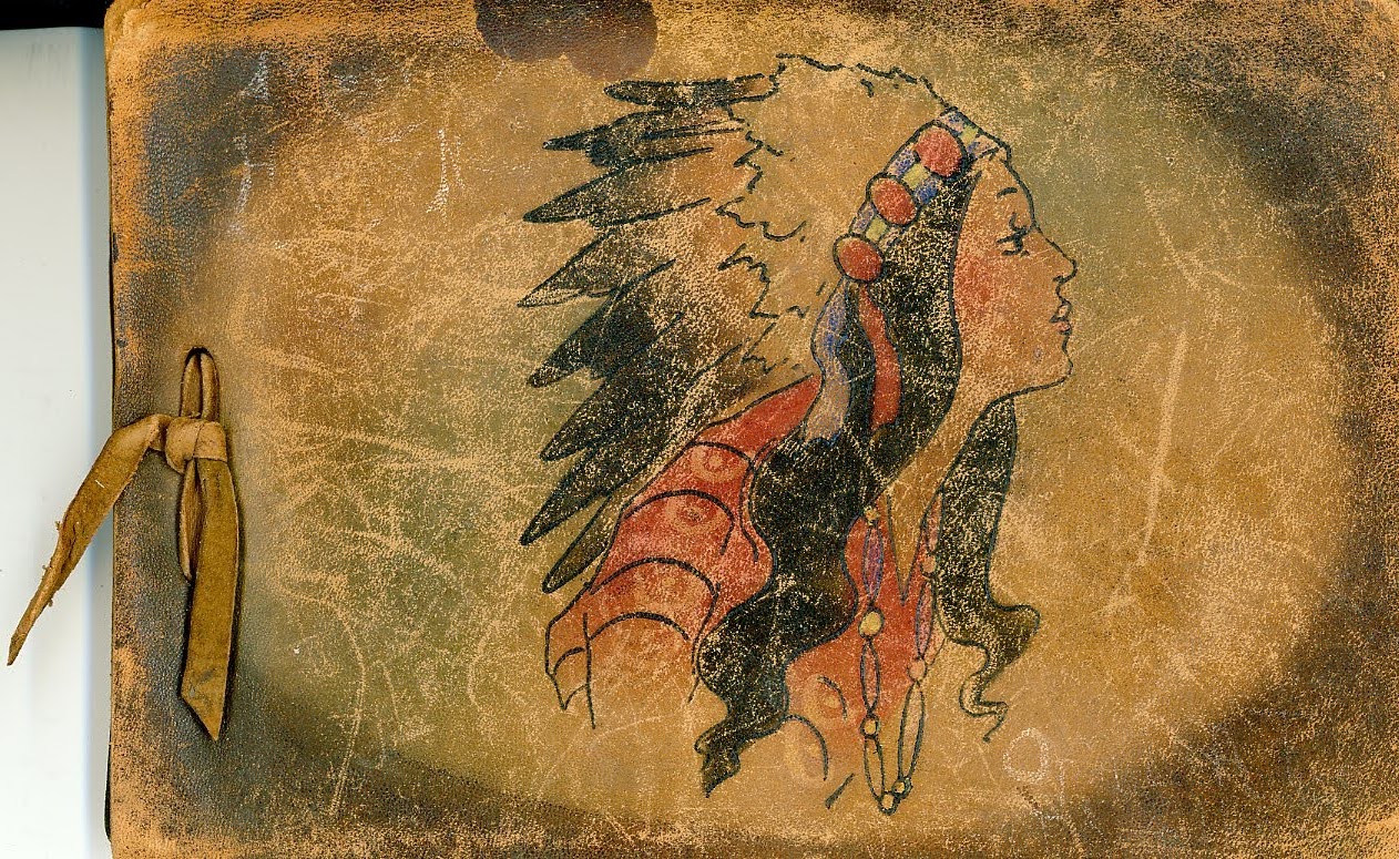 Cover of scrapbook showing a Native American woman in a ceremonial bonnet